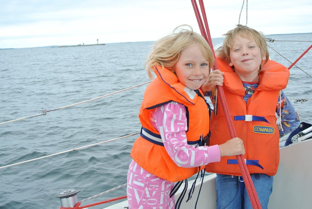 Two kids wearing life jackets