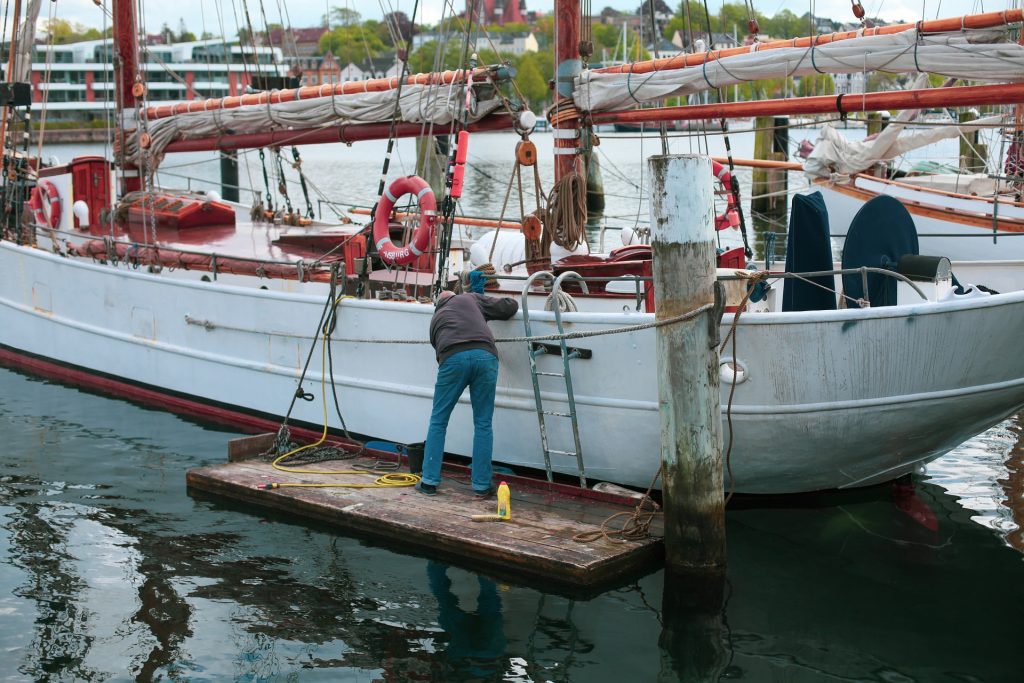 Man cleaning his boat