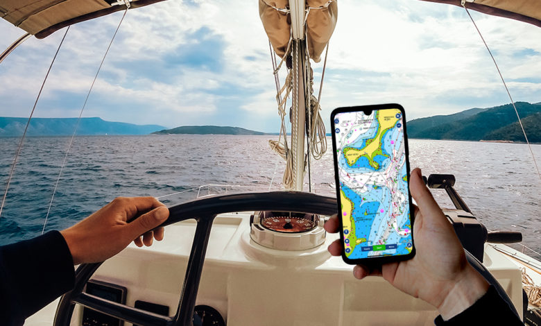 man using a phone while sea navigation