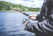 man holding a fishing rod