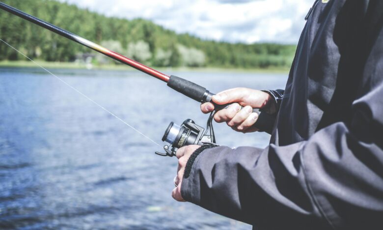 man holding a fishing rod